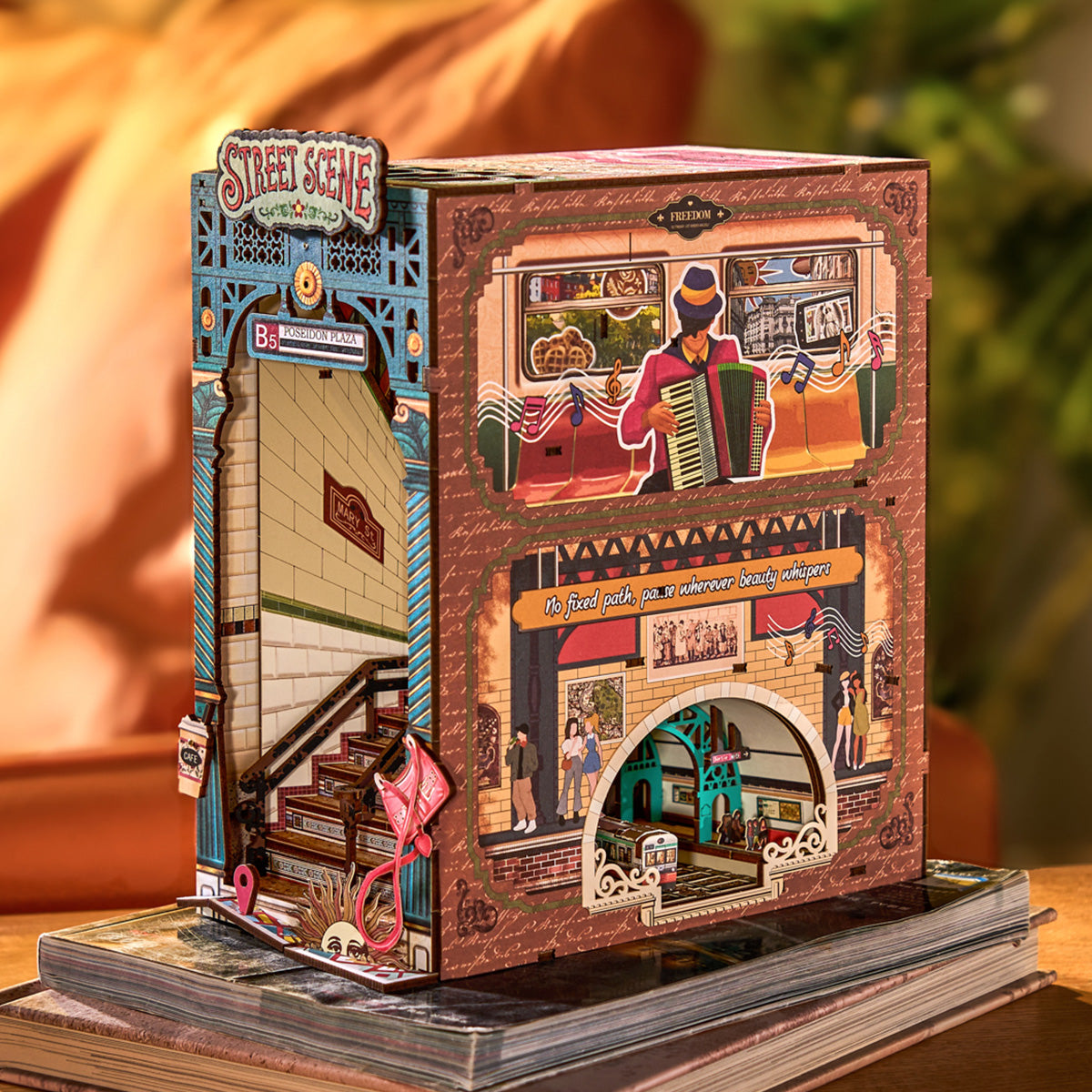 Rolife Street Scene TGB13 book nook with transparent dust cover being inserted showing the warm lit Poseidon Plaza interior from the front