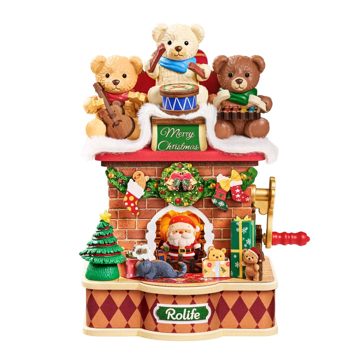 Rolife-Weihnachts-Kaminspieluhr vor weißem Hintergrund: drei musizierende Teddybären über einem Merry Christmas Schild, Ziegelkamin mit Weihnachtsmann, Baum, Geschenke und roter Kurbelgriff.
